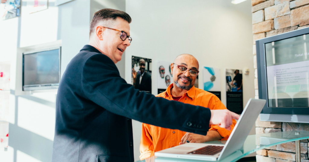 A technical sales person explaining a product to a client.